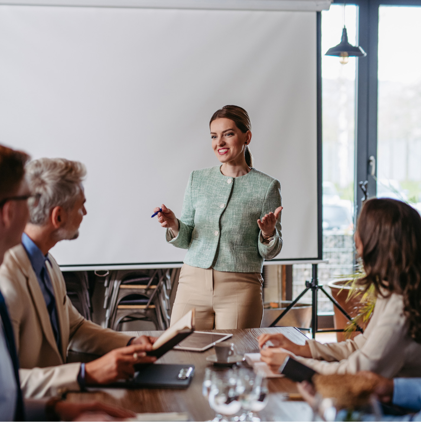 women presenting in meeting